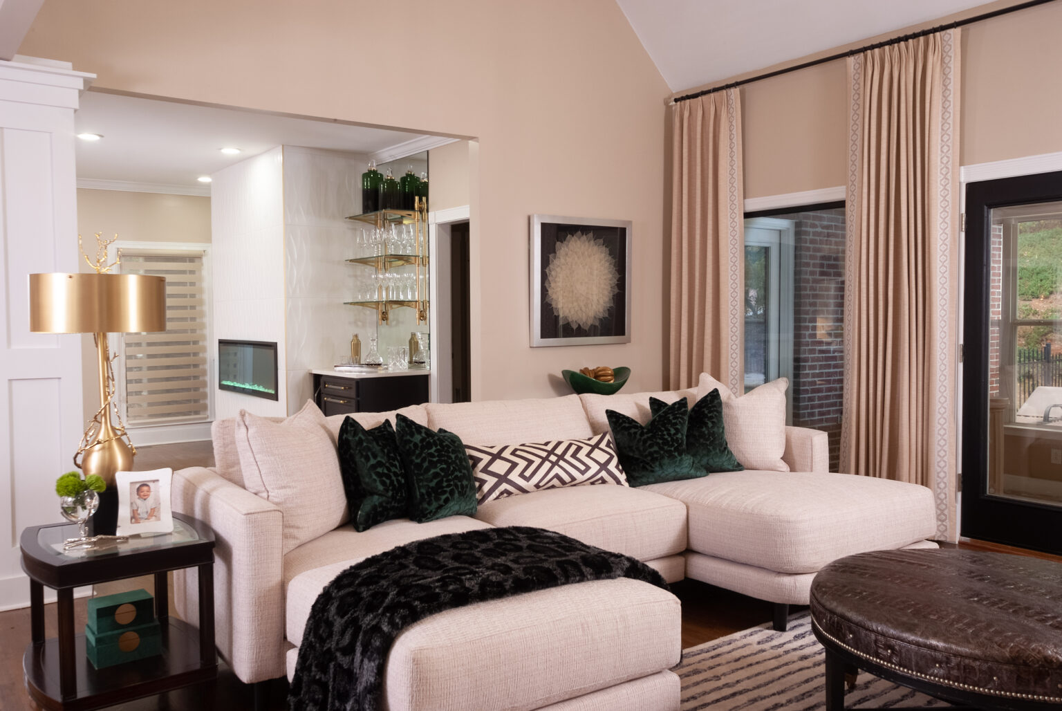 Neutral living space with green accents
